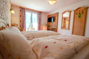 Postel nebo postele na pokoji v ubytování Hotel Blumental