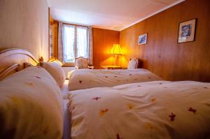 Postel nebo postele na pokoji v ubytování Hotel Blumental