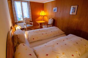 Postel nebo postele na pokoji v ubytování Hotel Blumental