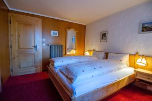 Postel nebo postele na pokoji v ubytování Hotel Blumental