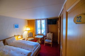 Postel nebo postele na pokoji v ubytování Hotel Blumental