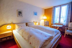 Postel nebo postele na pokoji v ubytování Hotel Blumental