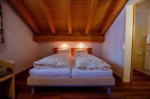 Postel nebo postele na pokoji v ubytování Hotel Blumental
