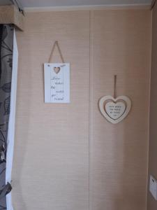 a paper heart hanging on a wall with a note at Port Haverigg Holiday Village in Millom