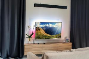Televízia a/alebo spoločenská miestnosť v ubytovaní EL Apartments - Antares