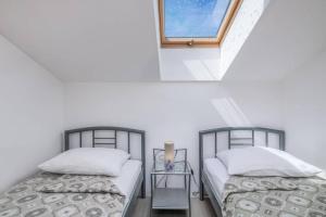 Postel nebo postele na pokoji v ubytování Apartment Windrose