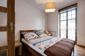 Posteľ alebo postele v izbe v ubytovaní Apartament Haffnera 10