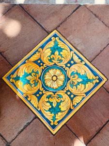a tile floor with a colorful pattern on it at Villa Le Gemelle Dell'Alcantara in Motta Camastra