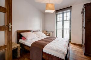 Posteľ alebo postele v izbe v ubytovaní Apartament Haffnera 10
