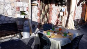 a table with food on it on a patio at Agriturismo Il Castagneto in Supino