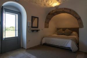 Postel nebo postele na pokoji v ubytování Grand Hotel la Chiusa di Chietri