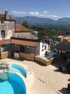 a view of a swimming pool from a house at Hotel PINO LORICATO in Castelluccio Inferiore