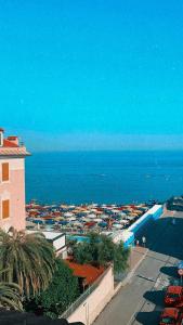 a view of a city and the ocean from a building at Hotel Aurora in Varazze