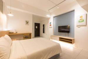 A television and/or entertainment centre at Shijo Inn