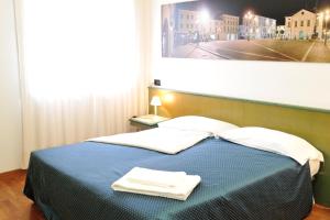 Postel nebo postele na pokoji v ubytování Rometta Hotel + 22 fotografií