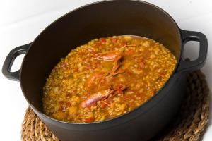 a pan filled with food sitting on a table at Hotel Tossal d'Altea in Altea