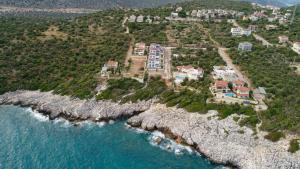 an aerial view of a house on a rocky island at Villa Noble in Demre