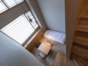 ONSEN RYOKAN Yuen Sapporo客房内的一张或多张床位