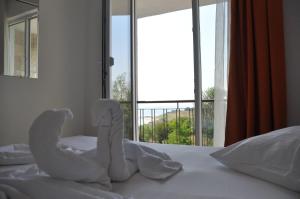 Postel nebo postele na pokoji v ubytování Hotel Cosmos