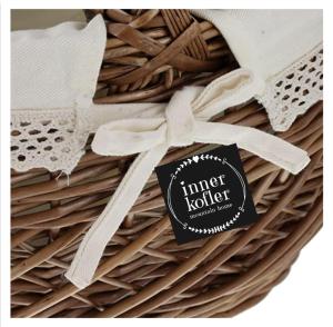 a basket with a tag on top of it at Appartements Innerkofler Mountain Home in San Candido