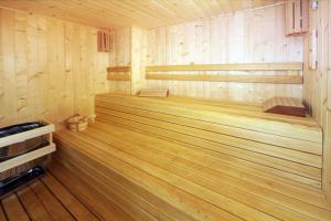 a sauna with wooden paneling and a wooden floor at Casa Consistorial in Fuengirola