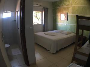 Postel nebo postele na pokoji v ubytování Hotel Pousada Calliandra