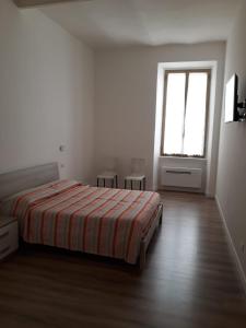 Postel nebo postele na pokoji v ubytování andri.trastevere