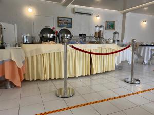 a room with a table with a yellow table cloth at Sailor's Nautical Concept in Spetses