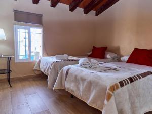 Łóżko lub łóżka w pokoju w obiekcie Apartamentos Jerez