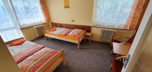 Postel nebo postele na pokoji v ubytování Hotel Poprad