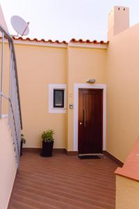 a hallway with a door on a building at Aurora Houses in Lagos