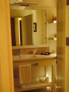 a bathroom with a sink and a mirror at D&C Göcek Hotel in Göcek