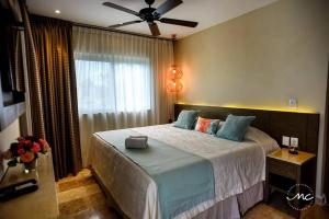 Tempat tidur dalam kamar di Puerto Morelos, Villa Mimi, Private Pool