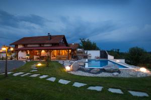 a home with a swimming pool and a house at Villa Brallissima in Sveti Martin na Muri