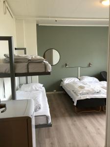 Postel nebo postele na pokoji v ubytování Ami Hotel