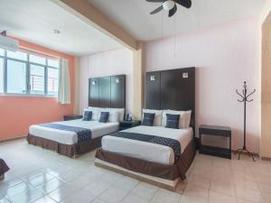 Ένα ή περισσότερα κρεβάτια σε δωμάτιο στο Hotel Spa Shalam