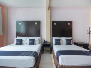 Ένα ή περισσότερα κρεβάτια σε δωμάτιο στο Hotel Spa Shalam