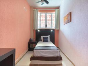 Ένα ή περισσότερα κρεβάτια σε δωμάτιο στο Hotel Spa Shalam
