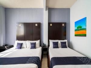 Ένα ή περισσότερα κρεβάτια σε δωμάτιο στο Hotel Spa Shalam