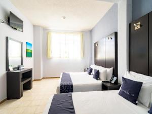 Ένα ή περισσότερα κρεβάτια σε δωμάτιο στο Hotel Spa Shalam