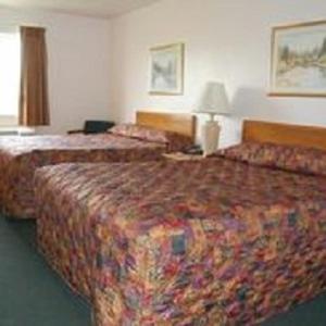 Ένα ή περισσότερα κρεβάτια σε δωμάτιο στο Country Haven Inn +5 φωτογραφίες