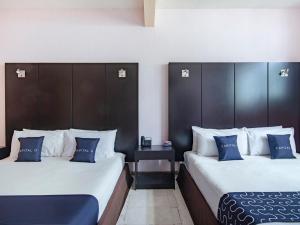 Ένα ή περισσότερα κρεβάτια σε δωμάτιο στο Hotel Spa Shalam
