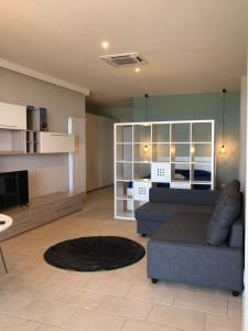 a living room with a couch and a table at SunRise Apartments in Termoli