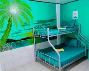 Postel nebo postele na pokoji v ubytování SmallFry's Beach Resort