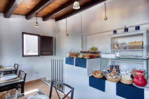 a kitchen filled with lots of different types of food at Cefalu in Blu in Cefalù