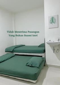 Area soggiorno di Anugrah Inn