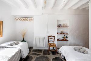Llit o llits en una habitació de Casa rural El Fuerte de Atabuey