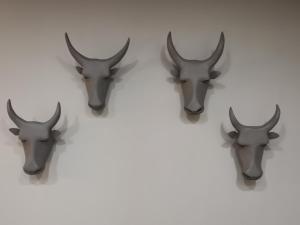four antlers of a deer head on a white wall at 84 On Marshall in Johannesburg