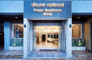 a building with a sign that reads powers residence group at Penyos Residence in Bangkok
