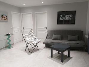 a living room with a couch and a chair at Elsanais in Figari